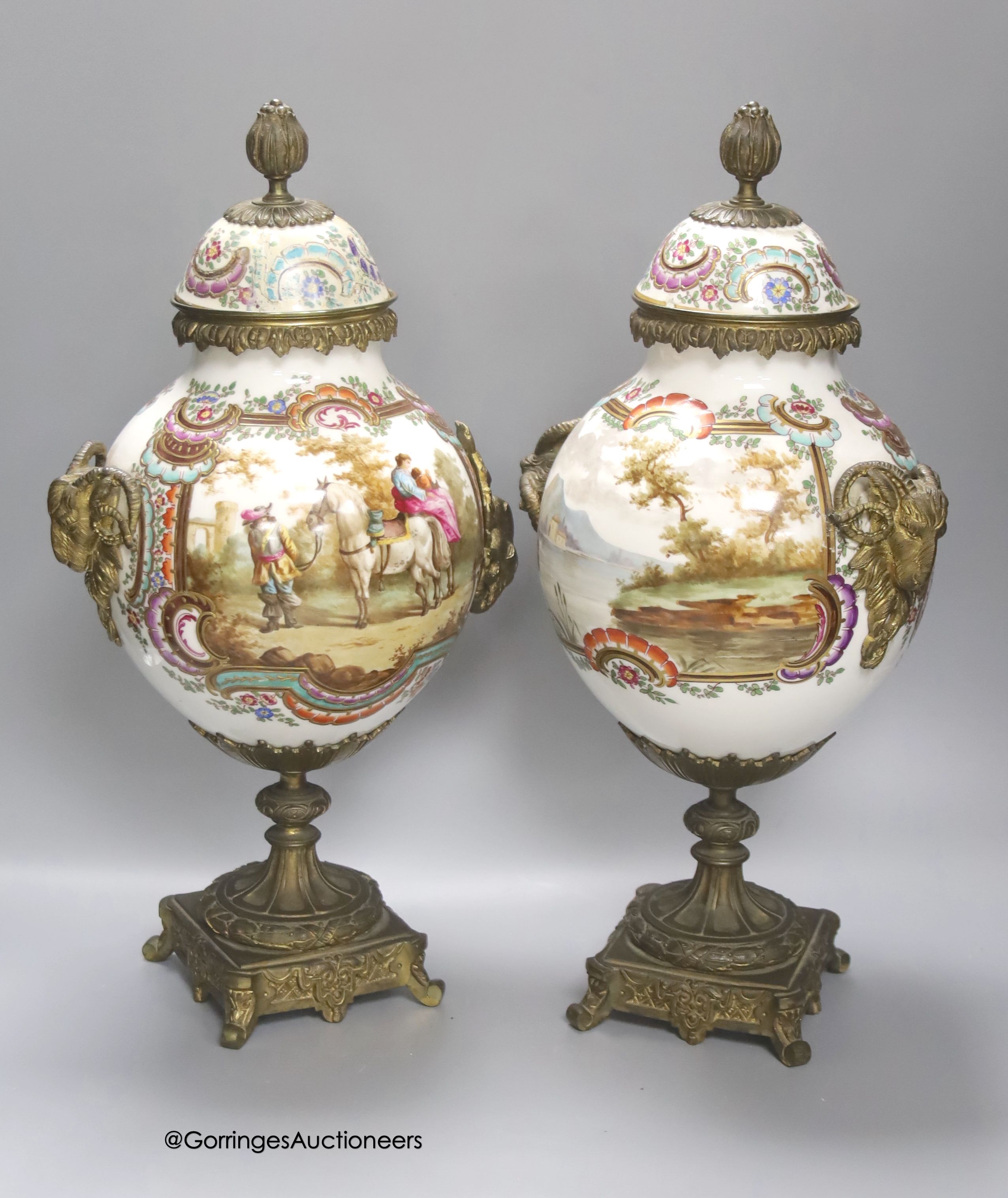 A pair of 19th century German ormolu mounted porcelain jars and covers, 41cm